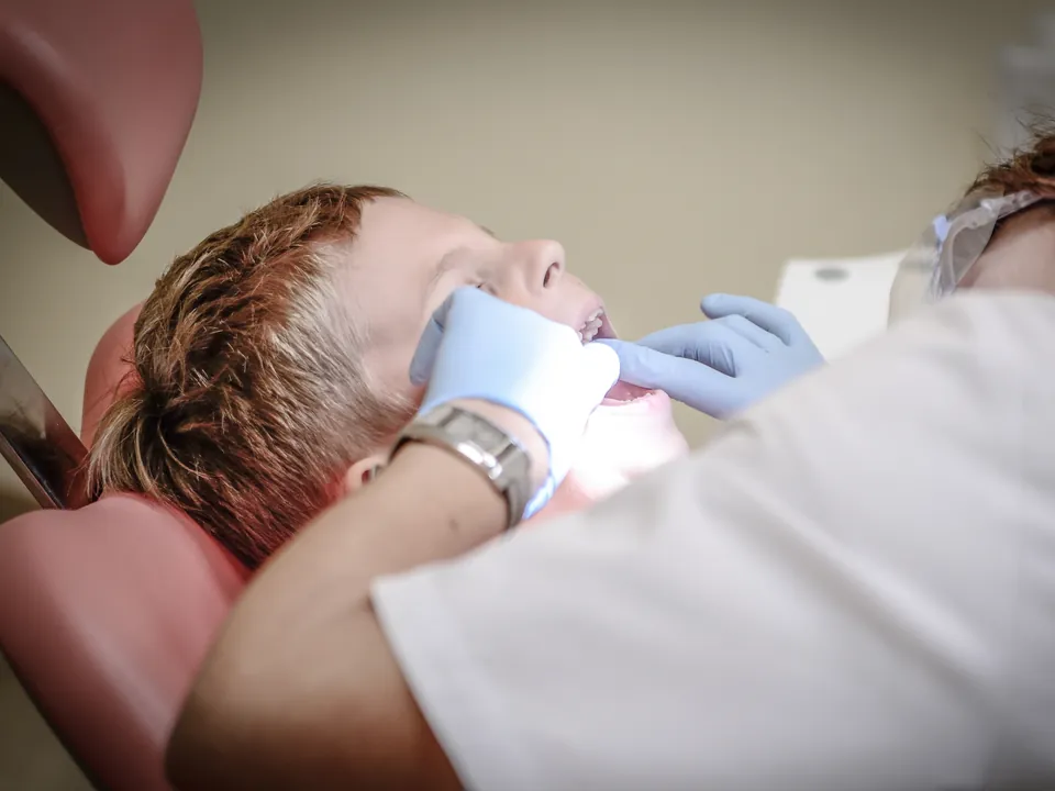 Dentist treating a patient in the chair